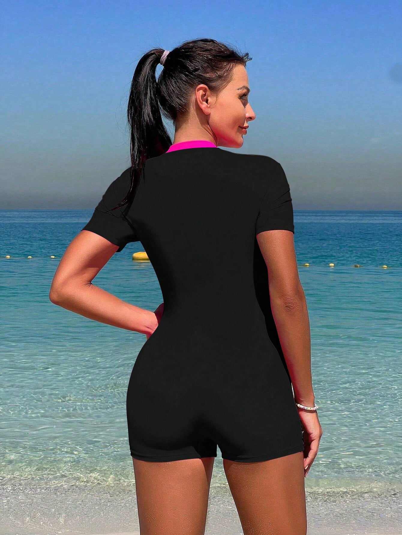 Traje de baño de una pieza Bikinx Summer Beach con cremallera y manga corta para surfear con paneles de neón en contraste