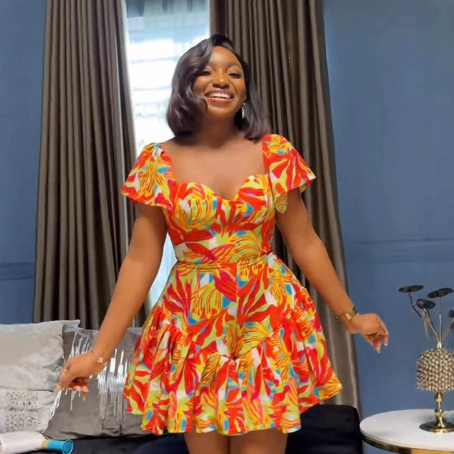 Mono elegante con estampado de cintura controlada, plisado y mangas con volantes