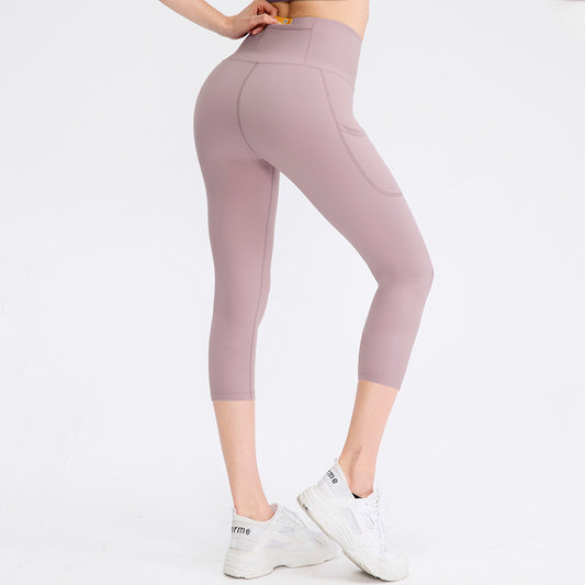 Pantalon skinny stretch à poches pour femme, taille haute, idéal pour le fitness et la course à pied.