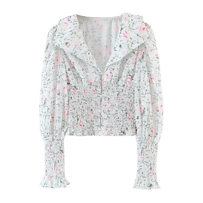 Chemise à manches longues à col large et taille élastiquée, style blogueuse automnale, à imprimé floral et manches lanternes, col rond et taille élastiquée.