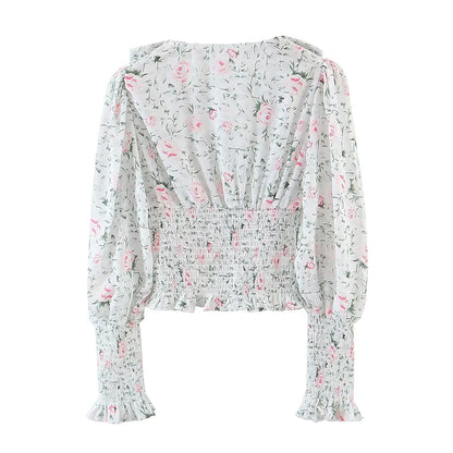 Chemise à manches longues à col large et taille élastiquée, style blogueuse automnale, à imprimé floral et manches lanternes, col rond et taille élastiquée.