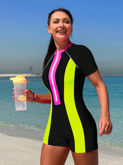 Traje de baño de una pieza Bikinx Summer Beach con cremallera y manga corta para surfear con paneles de neón en contraste