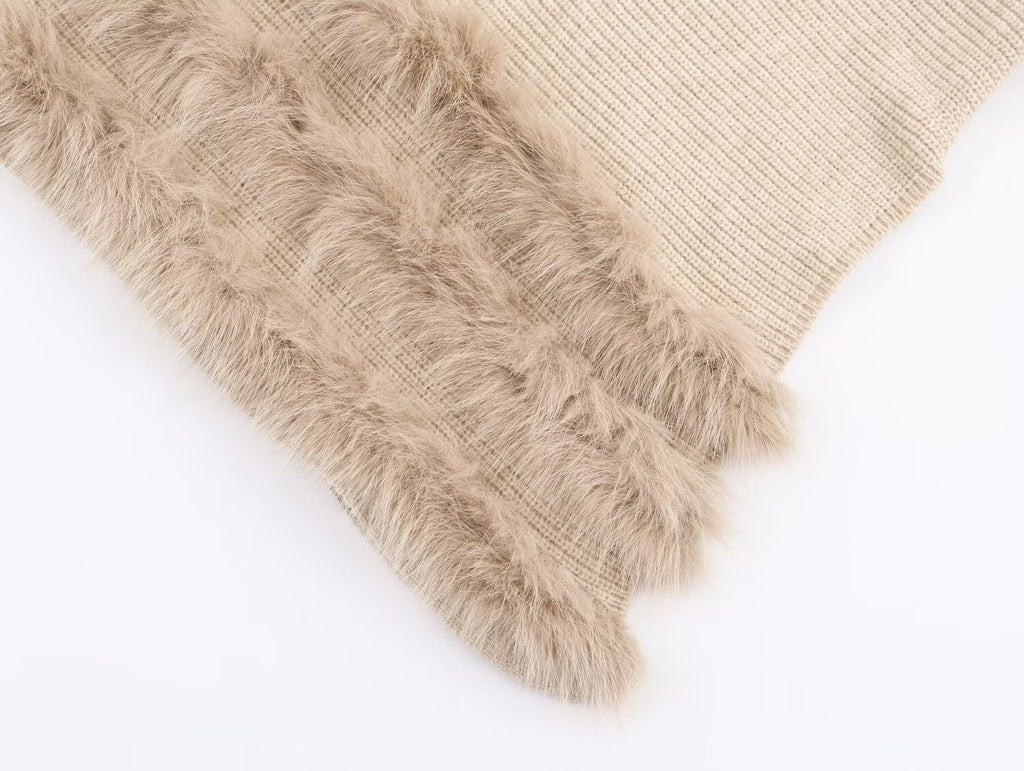 Pull asymétrique à col roulé et manches longues pour femme, style hiver, avec surpiqûres duveteuses et coupe ample.