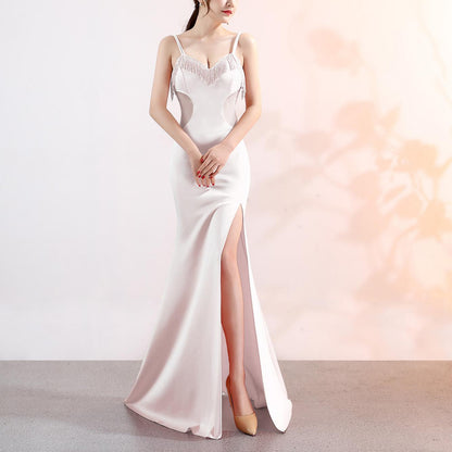 Robe de soirée longue et sexy à décolleté plongeant en V, coupe ajustée et fente, idéale pour les soirées en boîte de nuit ou les performances mondaines.