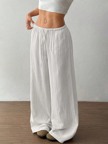 Pantalones casuales de algodón puro, color sólido, holgados, de pierna ancha y con cola deshilachada