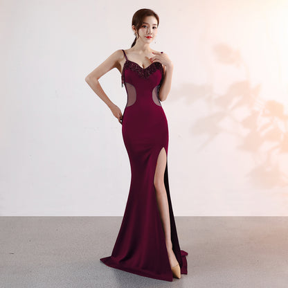 Robe de soirée longue et sexy à décolleté plongeant en V, coupe ajustée et fente, idéale pour les soirées en boîte de nuit ou les performances mondaines.