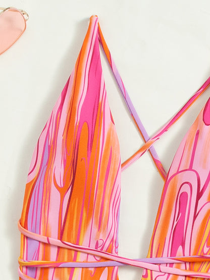Traje de baño de una pieza con espalda descubierta y estilo retro con tiras y cuello halter.