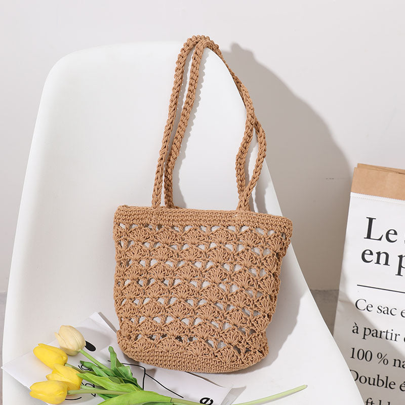 Bolso coreano de paja tejida a mano con hilo de algodón recortado y hueco, elegante bolso de un solo hombro, bolso portátil para playa y vacaciones en la playa. 