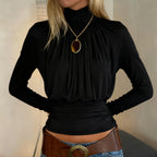 Camiseta negra oscura sexy con cuello alto y manga larga informal de cintura corta con control de adelgazamiento para mujer de otoño