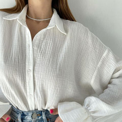 Chemise blanche décontractée à manches longues évasées pour femme, idéale pour l'automne.