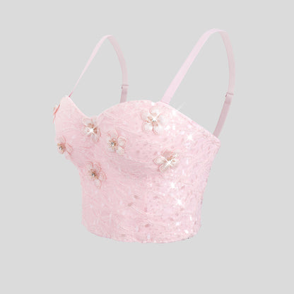 Haut bustier gainant à armatures, orné de strass floraux en relief et au design original tridimensionnel. Soutien-gorge à bretelles.