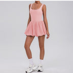 Vestido deportivo drapeado de dos piezas con bolsillos en la base, ideal para yoga, tenis y deportes.