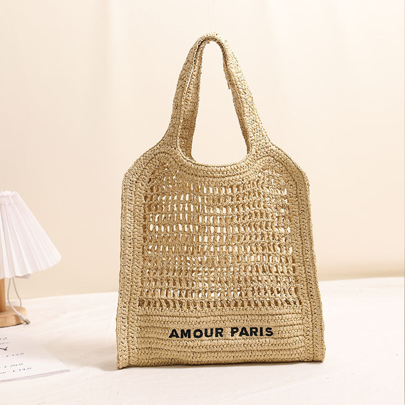 Bolso de paja tejido de verano con patrón de cordones, ideal para vacaciones en la playa. 