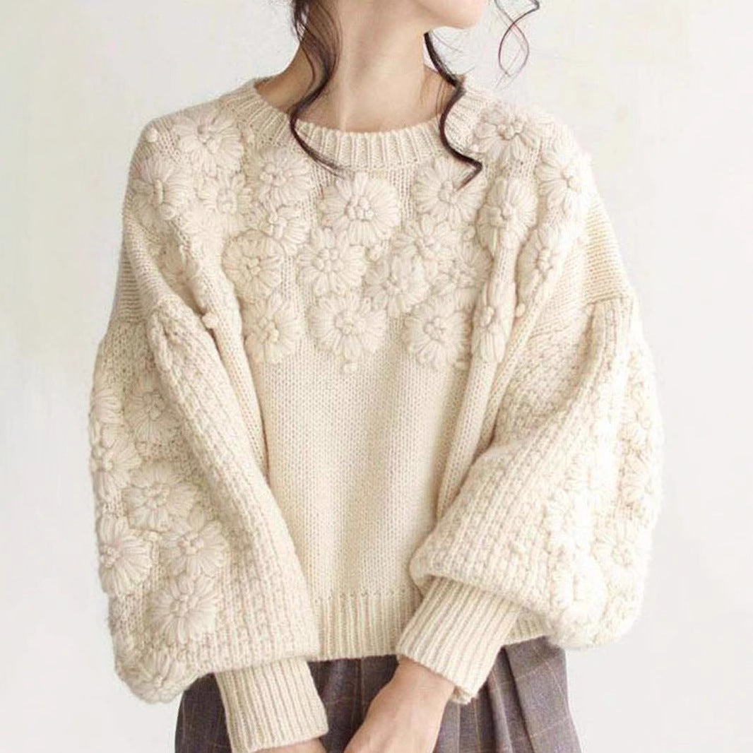 Suéter de punto suelto con cuello redondo y diseño de margaritas tridimensionales con bordado a máquina para otoño e invierno.