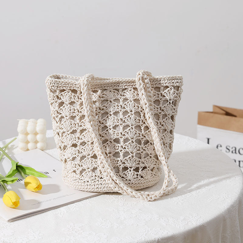 Bolso coreano de paja tejida a mano con hilo de algodón recortado y hueco, elegante bolso de un solo hombro, bolso portátil para playa y vacaciones en la playa. 