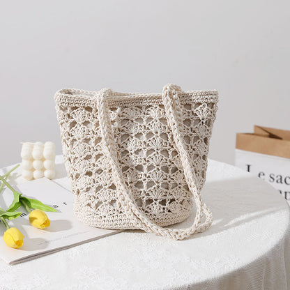 Bolso coreano de paja tejida a mano con hilo de algodón recortado y hueco, elegante bolso de un solo hombro, bolso portátil para playa y vacaciones en la playa. 