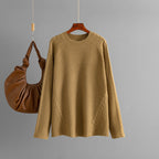 Tricots automne-hiver pour femmes, col rond, coupe ample et torsadée, coloris uni.