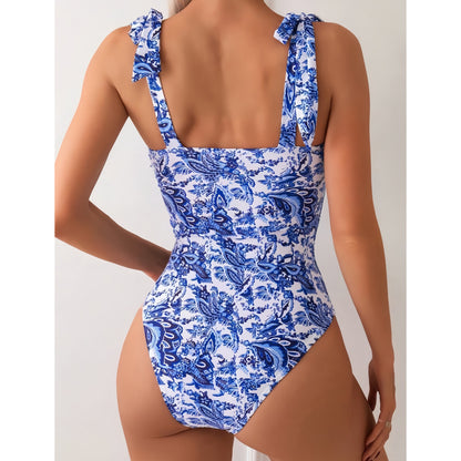 Traje de baño conservador de bikini siamés con estampado digital que cubre el vientre y adelgaza el escote en V.