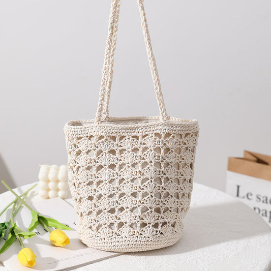Bolso coreano de paja tejida a mano con hilo de algodón recortado y hueco, elegante bolso de un solo hombro, bolso portátil para playa y vacaciones en la playa. 